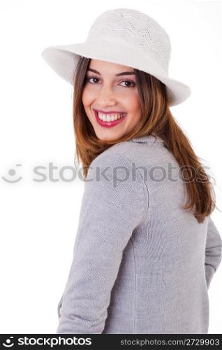 Young smiling face model wearing a coat and hat on a white background