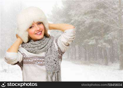 Young smiling girl at snowy forest