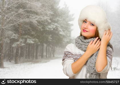 Young smiling girl at winter forest