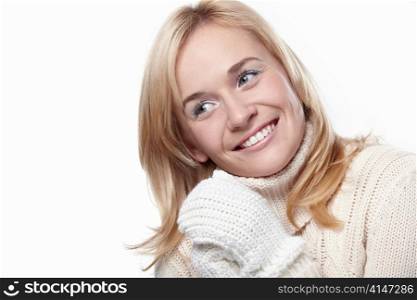 Young smiling girl in the mittens on a white background