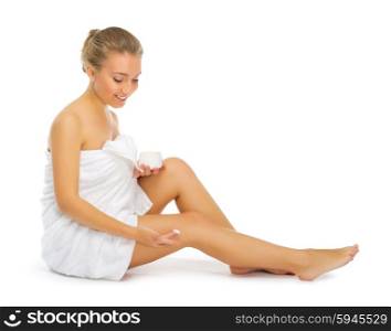 Young smiling girl with body cream isolated