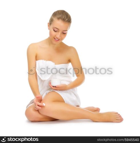 Young smiling girl with body cream isolated