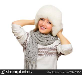 Young smiling girl with fur hat isolated