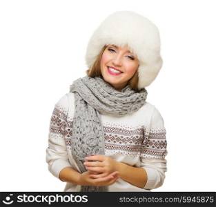 Young smiling girl with fur hat isolated