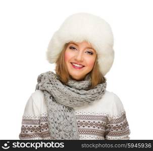 Young smiling girl with fur hat isolated on white