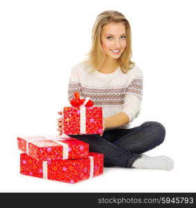 Young smiling girl with gift boxes isolated