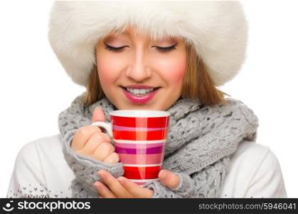 Young smiling girl with sweater and mug isolated