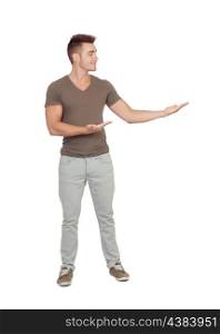 Young smiling man shows something isolated on white