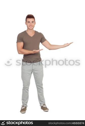 Young smiling man shows something isolated on white