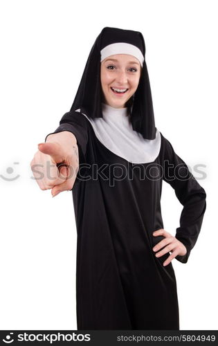 Young smiling nun pointing isolated on white