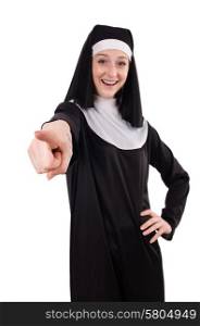 Young smiling nun pointing isolated on white