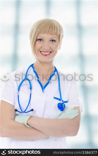 Young smiling nurse in uniform in his office
