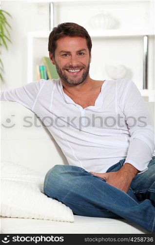 Young smiling on white sofa
