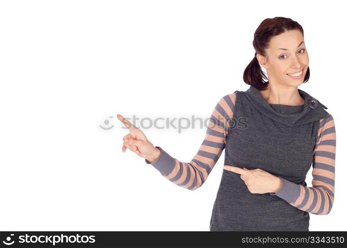 Young smiling woman in casual clothing showing something on the left, isolated on white background.