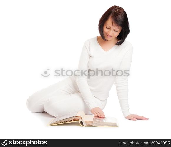 Young smiling woman looking album isolated