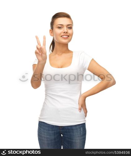 young smiling woman showing victory or peace sign
