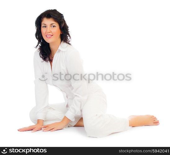 Young smiling woman sitting on floor isolated