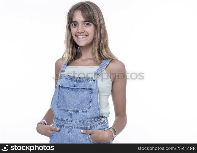 Young smiling woman standing with hands in pockets, wearing Texan jumpsuit with copy space, isolated on white background