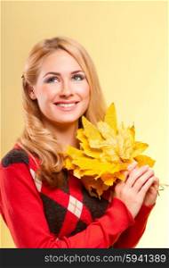 Young smiling woman with autumn leaves