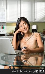 Young Smiling Woman With Laptop and Cellphone