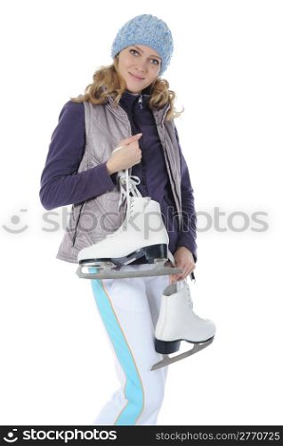 Young smiling woman with skates in studio. Isolated on white background