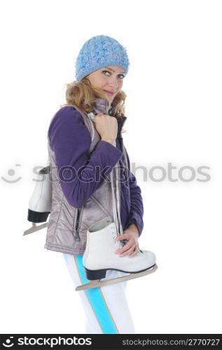 Young smiling woman with skates in studio. Isolated on white background
