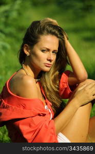 young sommer woman on green grass