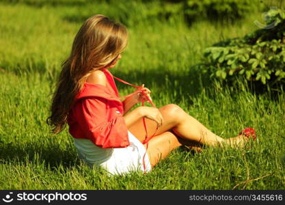 young sommer woman on green grass