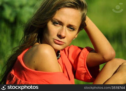 young sommer woman on green grass