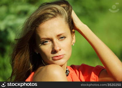 young sommer woman on green grass