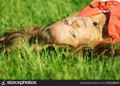 young sommer woman on green grass