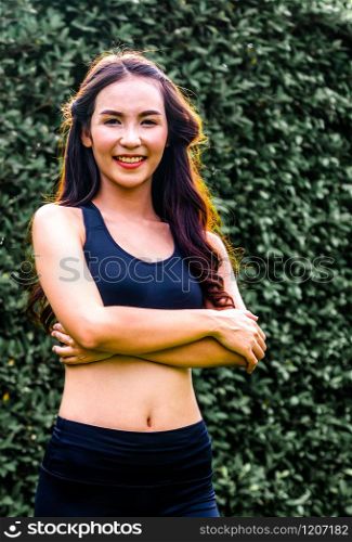 Young sport woman doing morning exercise in public park. Healthy lifestyle concept.