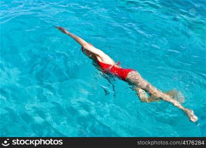 Young sports woman swims