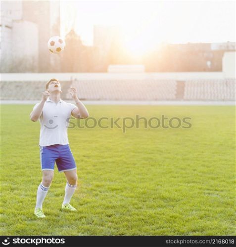young sportsman throwing ball