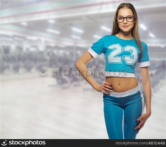 Young sporty girl at fitness club
