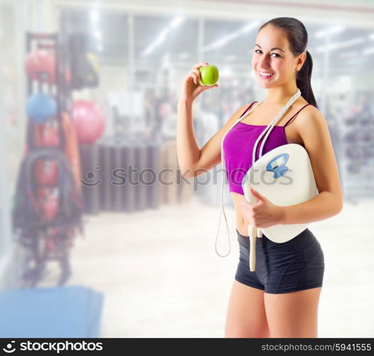 Young sporty girl at fitness club