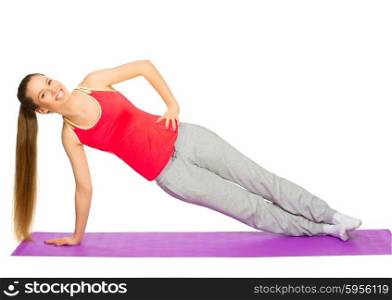 Young sporty girl doing gymnastic exercises isolated