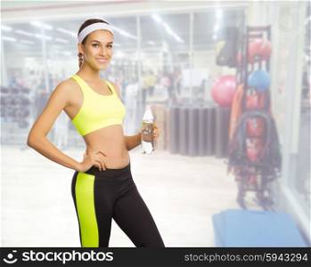 Young sporty girl in fitness club