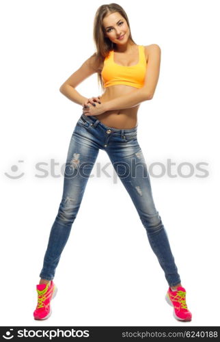 Young sporty girl in jeans isolated