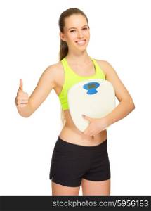 Young sporty girl with home scales isolated