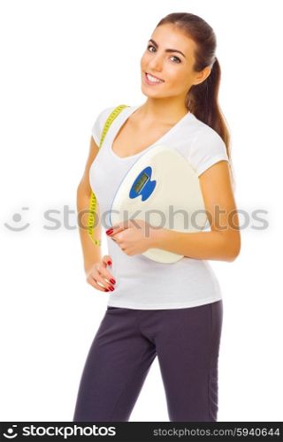 Young sporty girl with measurement tape and scales isolated
