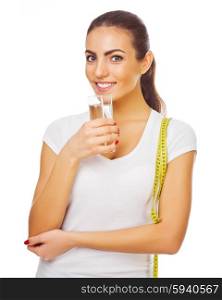 Young sporty girl with measurement tape and water glass isolated
