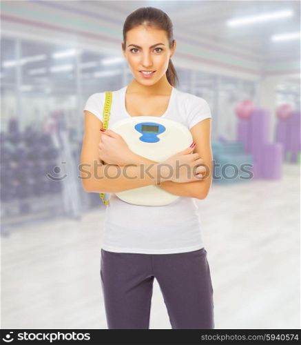 Young sporty woman at fitness club