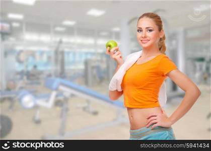 Young sporty woman at fitness club