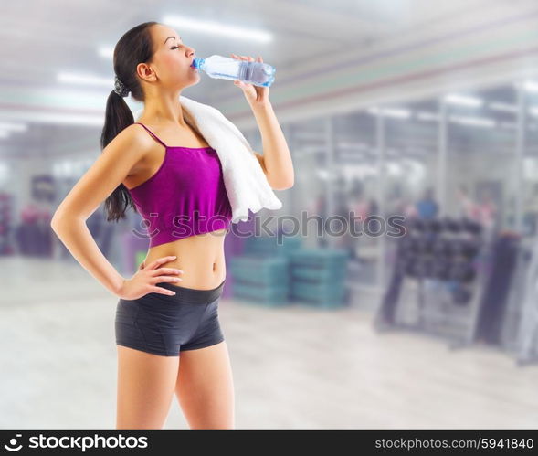 Young sporty woman at fitness club