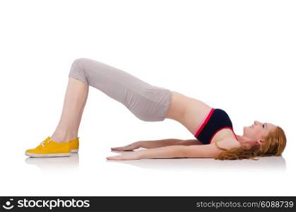 Young sporty woman doing exercises on white