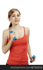 young sporty woman exercising with dumbbells. young blonde sporty fitness woman exercising with dumbbells on white background