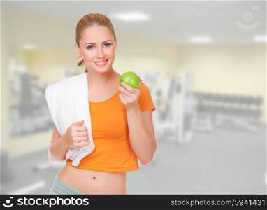 Young sporty woman with apple