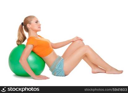 Young sporty woman with gymnastic ball