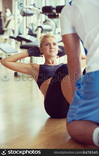 young sporty woman with trainer exercise in fitness gym